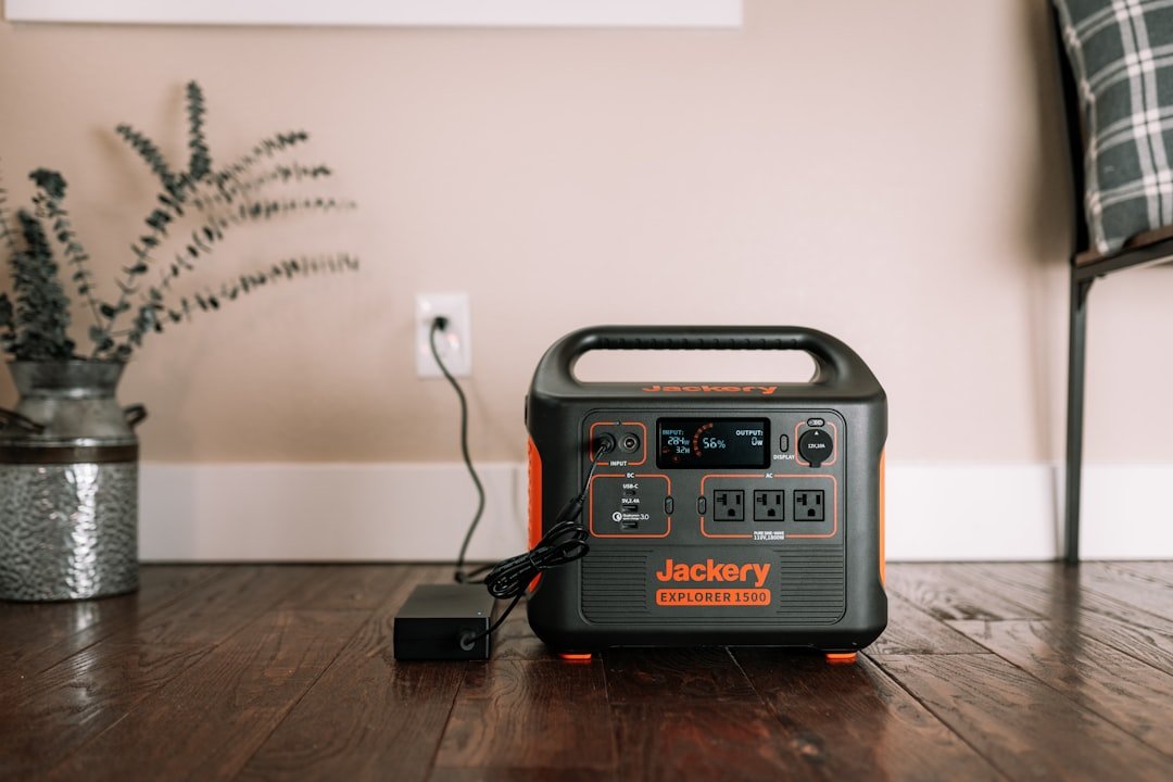 A portable power station in an outdoor setting, showcasing its use during an emergency situation with lights and devices powered.