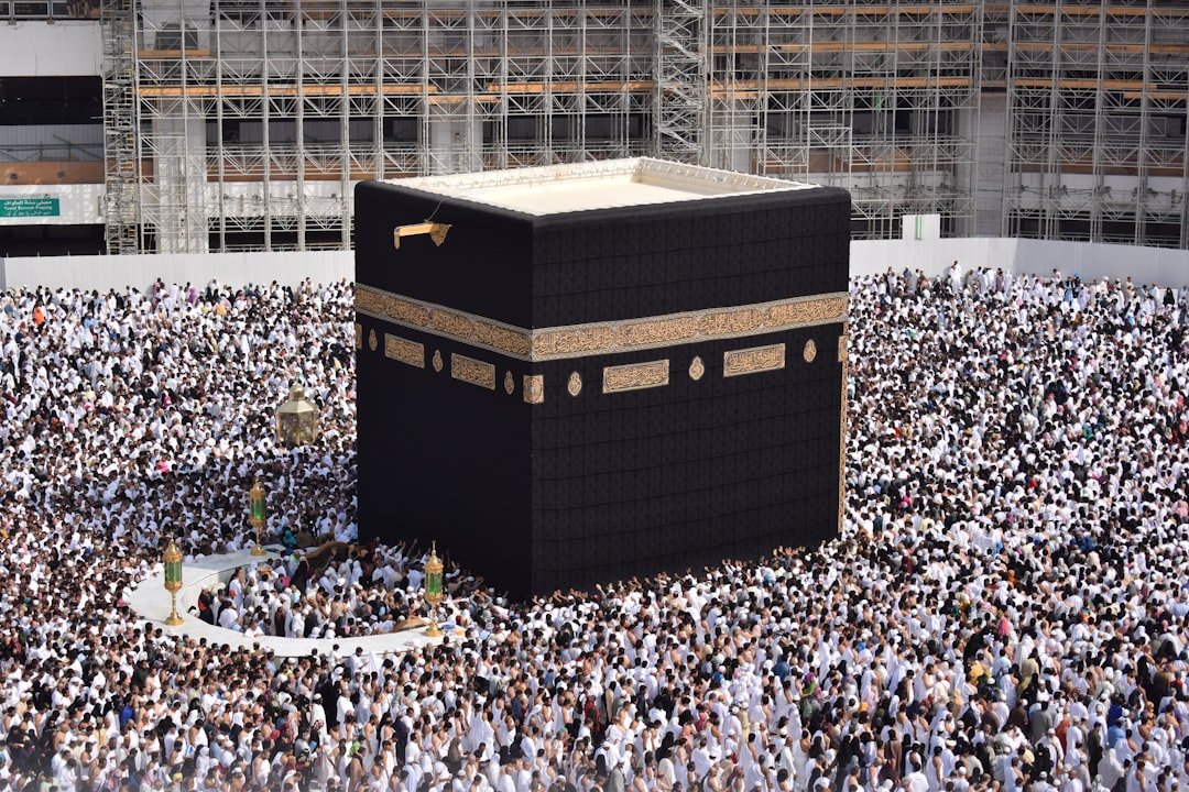 A serene landscape of pilgrims performing rituals during Hajj or Umrah, showcasing devotion and spirituality.