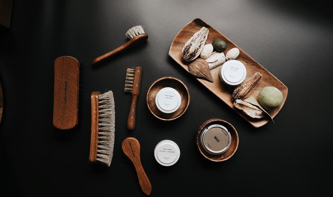 A compact travel kit with essential personal care items like toiletries, sunscreen, and hygiene products, set against a backdrop of travel essentials.